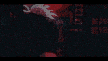 a close up of a person 's face with a red light shining on it