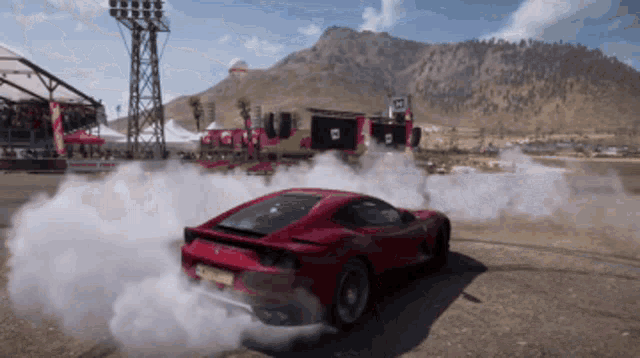 a red sports car with a license plate that says ' gm ' on it