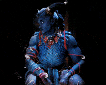 a blue demon with horns is wearing a necklace and bracelets