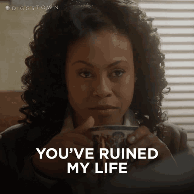 a woman holding a cup of coffee with the words you 've ruined my life