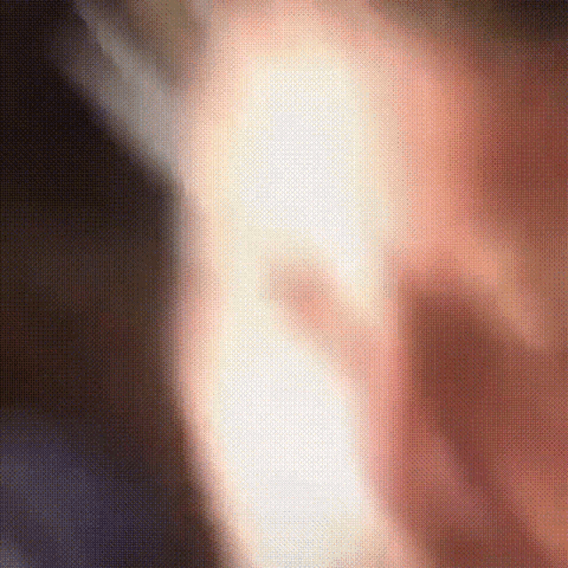 a close up of a person 's face with a blurry background