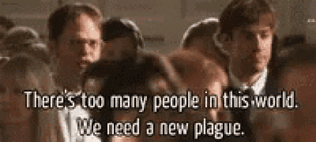 a crowd of people are standing in a room with a quote that says `` there 's too many people in this world .