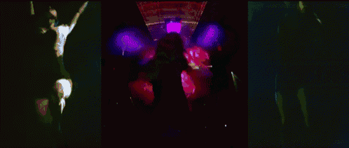 a woman with blue hair is dancing in a purple circle