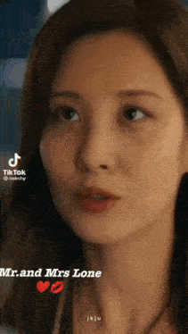 a close up of a woman 's face with the words `` and mrs lone '' on the bottom .
