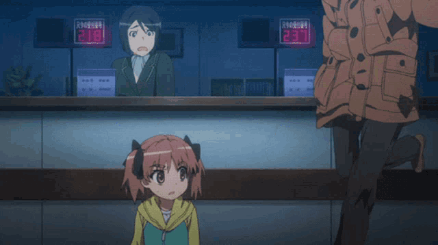 a girl screams in front of a counter with a display that says 218