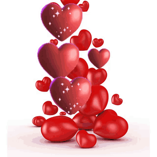 a bunch of red hearts are stacked on top of each other on a white background