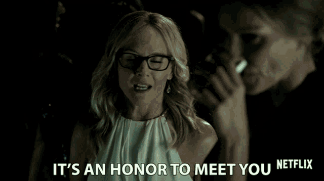 a woman with glasses says " it 's an honor to meet you "
