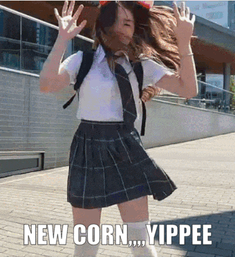 a girl in a school uniform is dancing with the words new corn yippee below her