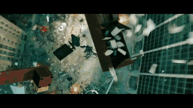 a large explosion in a city with a lot of papers falling from the sky