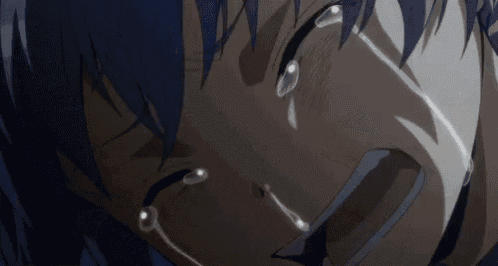 a close up of a person 's face with tears running down their face .