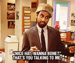 a man in a suit and tie says nice hat wanna bone