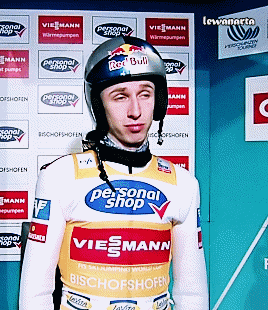 a man wearing a helmet that says red bull