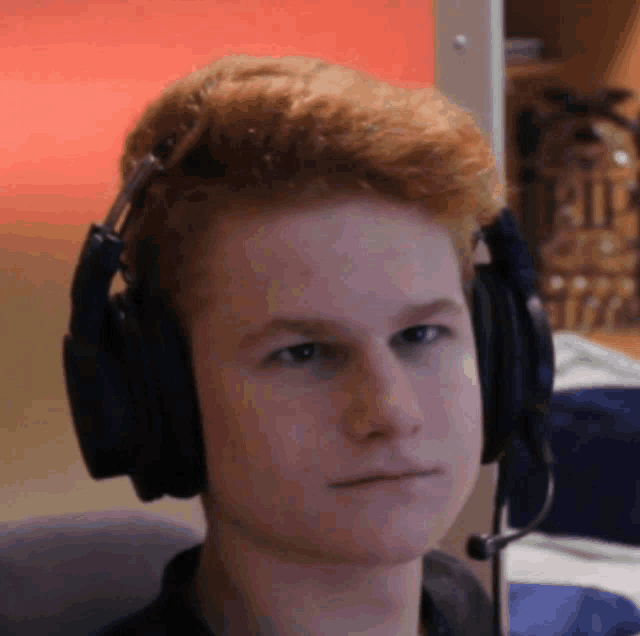 a young man wearing headphones and a microphone with the word pit in the background