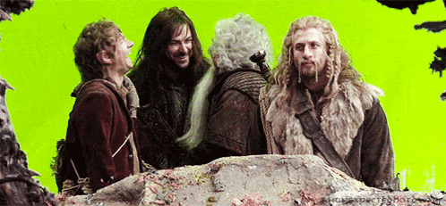 a group of men are standing next to each other on a green background .