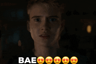 a close up of a man 's face with the words bae written below him