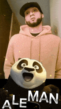 a man in a hoodie is standing next to a panda bear with the word aleman on the bottom