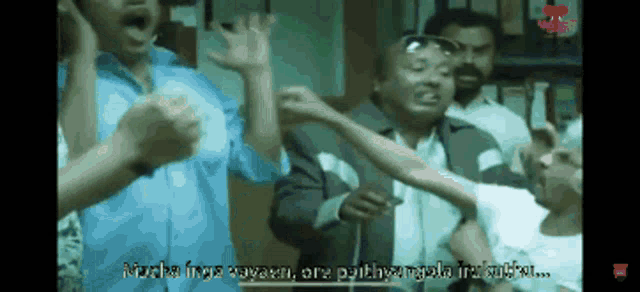 a group of people are standing in a room and one of them says " mucha inga rupan "