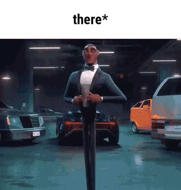 a man in a tuxedo is standing in a parking garage with cars and says there