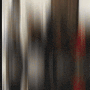a blurred image of a person standing in a room