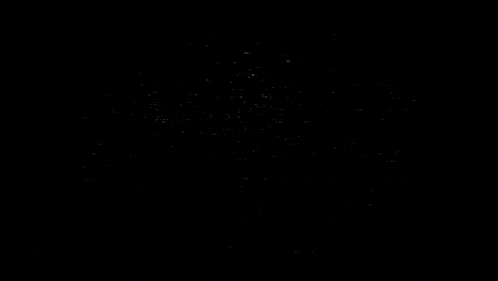 a black and white image of a brick wall with a lot of noise and a few lights coming out of it .