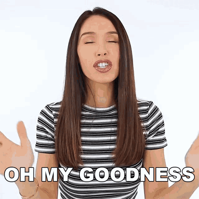 a woman in a striped shirt says oh my goodness with her eyes closed