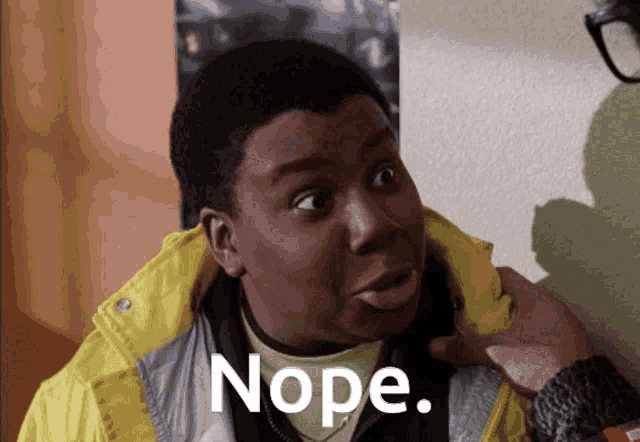 a man in a yellow jacket has the word nope written on his face