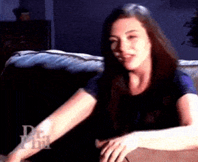 a woman sitting on a couch with the word dr. phil on the bottom right