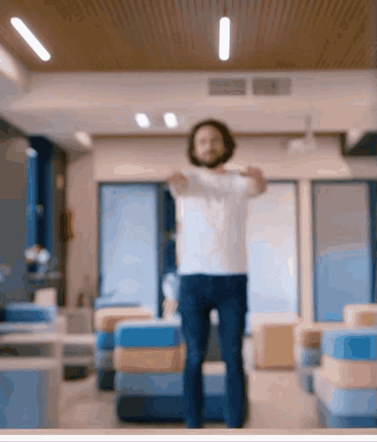 a man with a beard is stretching his arms