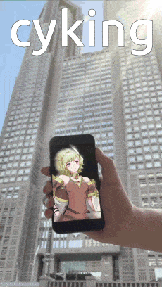 a person is holding a cell phone with a picture of a girl on the screen and the word cyking in white letters