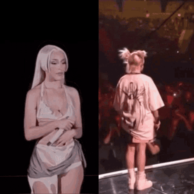 a woman in a pink shirt with a spider on the back is standing on a stage