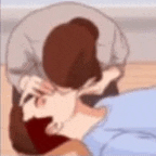 a man is holding a woman 's head while she is laying on the floor .