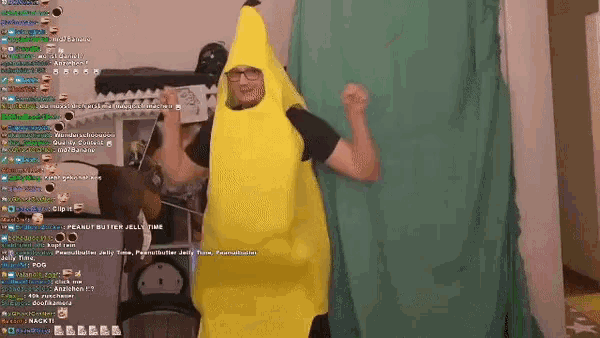 a man in a yellow banana costume is dancing in front of a green screen