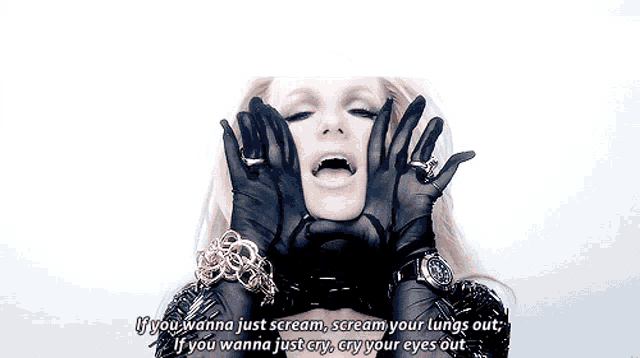 britney spears is wearing black gloves and a watch and says if you wanna just scream scream your lungs out