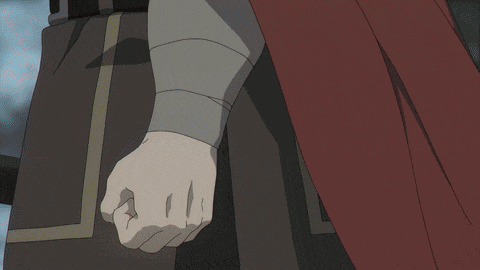 a close up of a person 's fist with bandages on it