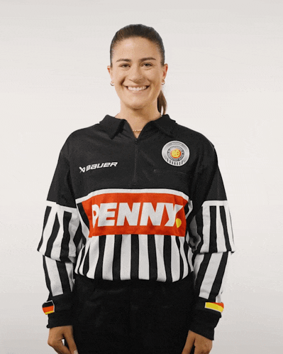 a woman wearing a black and white jersey with the word penny on the front