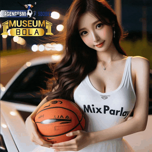 a woman holding a basketball in front of a sign that says " museum bola "