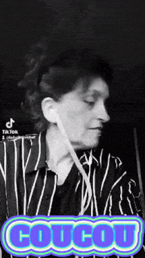 a black and white photo of a woman with the word coucou in the upper right corner