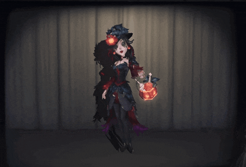 a woman in a black dress is holding a pumpkin in her hands
