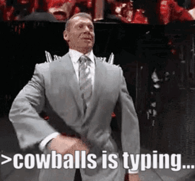 a man in a suit and tie is saying cowballs is typing ..