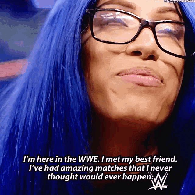 a woman with blue hair is wearing glasses and says " i 'm here in the wwe i met my best friend "