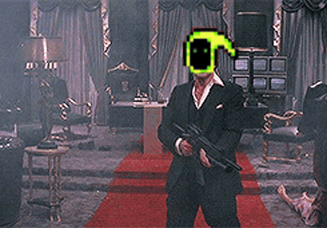 a man in a suit is holding a gun in a room