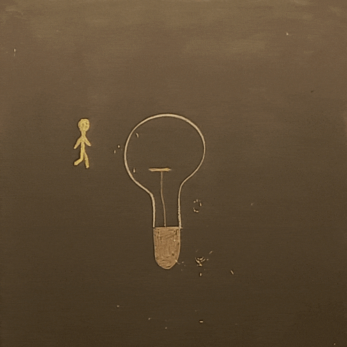 a chalk drawing of a light bulb with a stick figure standing next to it