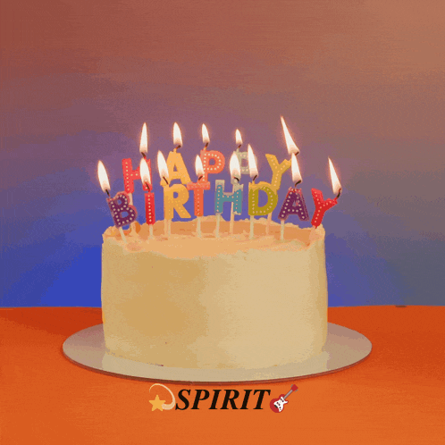 a birthday cake with candles that spell happy birthday