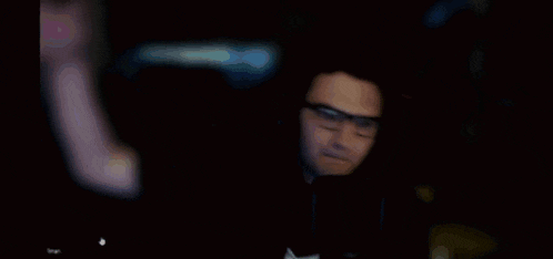 a computer generated image of a person 's face with a purple light coming out of it
