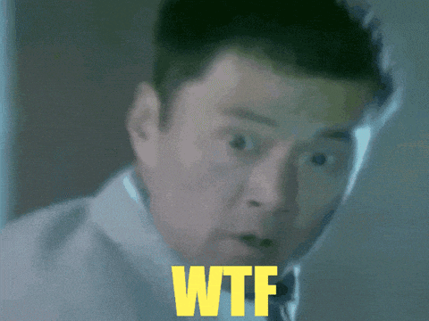 a close up of a man 's face with the word wtf written in yellow