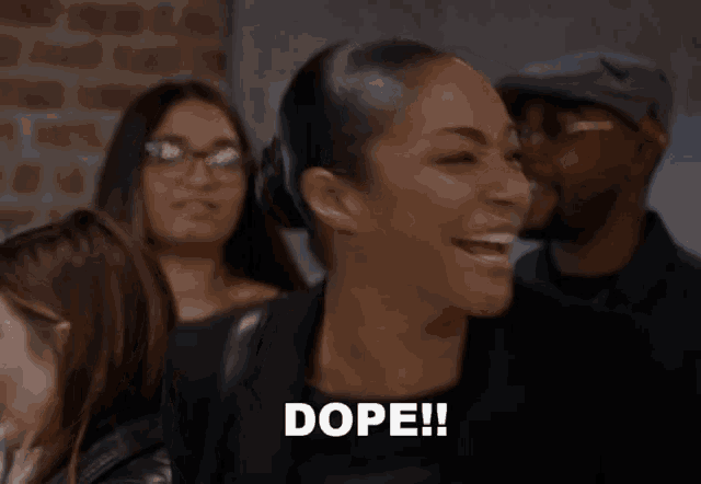 a woman in a crowd says dope in front of her