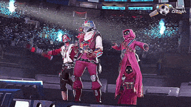 a group of people standing in front of a screen that says ozana on it