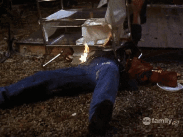 a person is laying on the floor with a abc family logo on the bottom