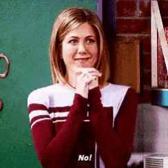 a woman in a maroon and white striped sweater is holding a cup and saying no .