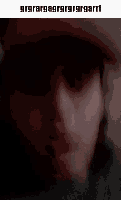 a blurry picture of a man 's face with the words grgrargagrgrgrgrgarrf written above it